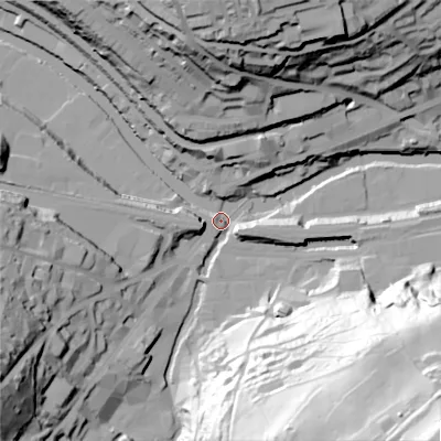 Shaded relief map of the ground around HX63LB, computed from Environment Agency LiDAR. The ground here sits at about 76 m above sea level and falls 109 m across the surrounding 800 m. Surface water reaching this point runs off ground lying to the south-east, 107.6 m higher.