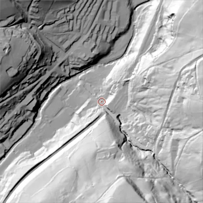 Shaded relief map of the ground around HX64DR, computed from Environment Agency LiDAR. The ground here sits at about 129 m above sea level and falls 112 m across the surrounding 800 m. Surface water reaching this point runs off ground lying to the south, 98.8 m higher.