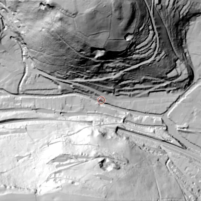 Shaded relief map of the ground around HX76LH, computed from Environment Agency LiDAR. The ground here sits at about 101 m above sea level and falls 146 m across the surrounding 800 m. Surface water reaching this point runs off ground lying to the north, 143.6 m higher.