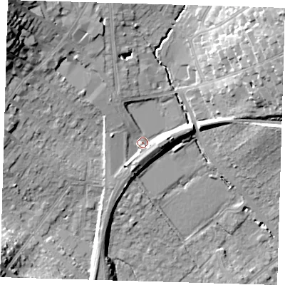 Shaded relief map of the ground around IG104PD, computed from Environment Agency LiDAR. The ground here sits at about 26 m above sea level and falls 27 m across the surrounding 800 m. Surface water reaching this point runs off ground lying to the east, 6.8 m higher.