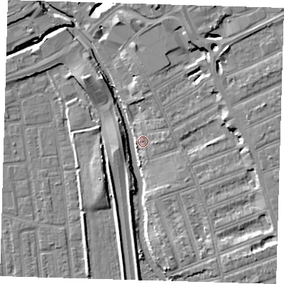 Shaded relief map of the ground around IG12EE, computed from Environment Agency LiDAR. The ground here sits at about 6 m above sea level and falls 11 m across the surrounding 800 m. Surface water reaching this point runs off ground lying to the west, 5.1 m higher.