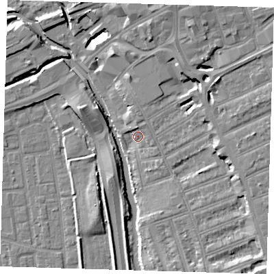 Shaded relief map of the ground around IG12EG, computed from Environment Agency LiDAR. The ground here sits at about 7 m above sea level and falls 11 m across the surrounding 800 m. Surface water reaching this point runs off ground lying to the north, 3.9 m higher.