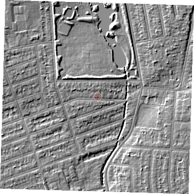 Shaded relief map of the ground around IG12TH, computed from Environment Agency LiDAR. The ground here sits at about 9 m above sea level and falls 6 m across the surrounding 800 m. Surface water reaching this point runs off ground lying to the north-west, 1.0 m higher.