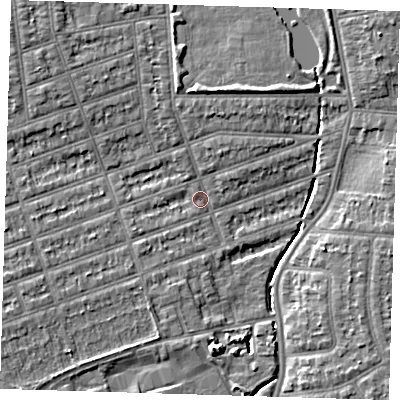 Shaded relief map of the ground around IG12XP, computed from Environment Agency LiDAR. The ground here sits at about 8 m above sea level and falls 6 m across the surrounding 800 m. Surface water reaching this point runs off ground lying to the north-west, 3.9 m higher.