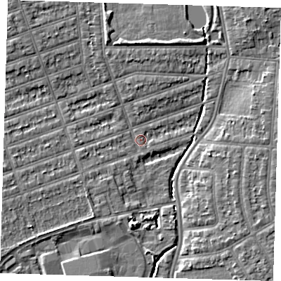 Shaded relief map of the ground around IG12XR, computed from Environment Agency LiDAR. The ground here sits at about 8 m above sea level and falls 7 m across the surrounding 800 m. Surface water reaching this point runs off ground lying to the north-west, 4.5 m higher.