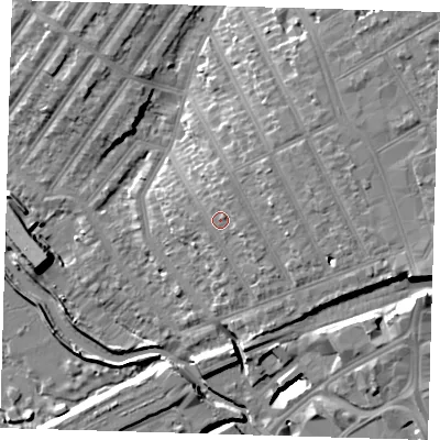 Shaded relief map of the ground around IG13AJ, computed from Environment Agency LiDAR. The ground here sits at about 11 m above sea level and falls 13 m across the surrounding 800 m. Surface water reaching this point runs off ground lying to the east, 1.7 m higher.