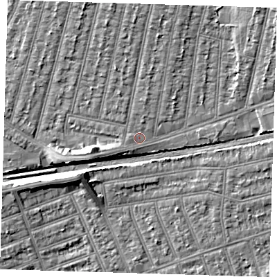Shaded relief map of the ground around IG38RQ, computed from Environment Agency LiDAR. The ground here sits at about 13 m above sea level and falls 7 m across the surrounding 800 m. Surface water reaching this point runs off ground lying to the north, 2.1 m higher.