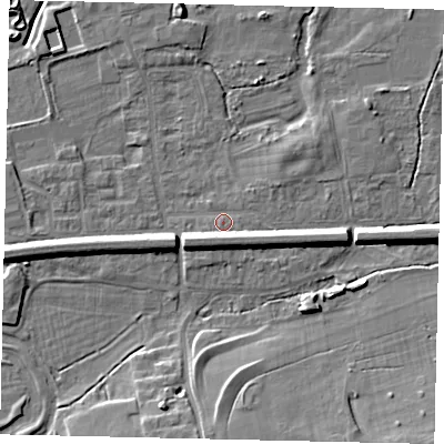 Shaded relief map of the ground around KT108BB, computed from Environment Agency LiDAR. The ground here sits at about 12 m above sea level and falls 9 m across the surrounding 800 m. Surface water reaching this point runs off ground lying to the south, 5.2 m higher.