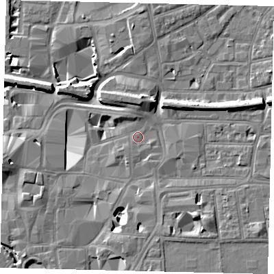 Shaded relief map of the ground around KT11SP, computed from Environment Agency LiDAR. The ground here sits at about 9 m above sea level and falls 11 m across the surrounding 800 m. Surface water reaching this point runs off ground lying to the north-north-west, 1.7 m higher.
