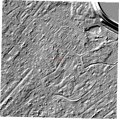 Shaded relief map of the ground around KT122AB, computed from Environment Agency LiDAR. The ground here sits at about 12 m above sea level and falls 15 m across the surrounding 800 m. Surface water reaching this point runs off ground lying to the south-west, 1.5 m higher.
