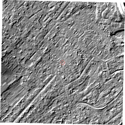 Shaded relief map of the ground around KT122AF, computed from Environment Agency LiDAR. The ground here sits at about 12 m above sea level and falls 15 m across the surrounding 800 m. Surface water reaching this point runs off ground lying to the south, 1.1 m higher.