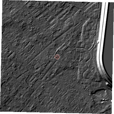 Shaded relief map of the ground around KT122AN, computed from Environment Agency LiDAR. The ground here sits at about 12 m above sea level and falls 15 m across the surrounding 800 m. Surface water reaching this point runs off ground lying to the north-east, 1.1 m higher.