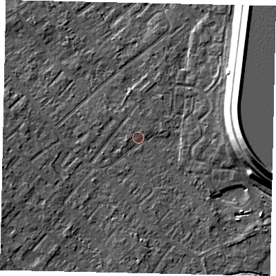 Shaded relief map of the ground around KT122AY, computed from Environment Agency LiDAR. The ground here sits at about 12 m above sea level and falls 15 m across the surrounding 800 m. Surface water reaching this point runs off ground lying to the west-south-west, 3.5 m higher.