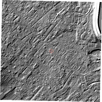 Shaded relief map of the ground around KT122BN, computed from Environment Agency LiDAR. The ground here sits at about 12 m above sea level and falls 15 m across the surrounding 800 m. Surface water reaching this point runs off ground lying to the west-south-west, 5.2 m higher.