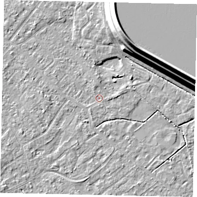Shaded relief map of the ground around KT122BX, computed from Environment Agency LiDAR. The ground here sits at about 12 m above sea level and falls 15 m across the surrounding 800 m. Surface water reaching this point runs off ground lying to the north, 1.0 m higher.