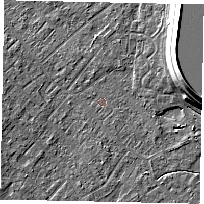 Shaded relief map of the ground around KT122DD, computed from Environment Agency LiDAR. The ground here sits at about 12 m above sea level and falls 15 m across the surrounding 800 m. Surface water reaching this point runs off ground lying to the south, 1.7 m higher.