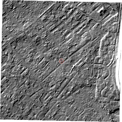 Shaded relief map of the ground around KT122DG, computed from Environment Agency LiDAR. The ground here sits at about 11 m above sea level and falls 13 m across the surrounding 800 m. Surface water reaching this point runs off ground lying to the east, 1.4 m higher.
