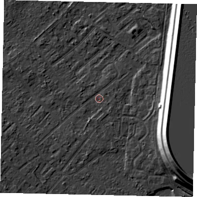 Shaded relief map of the ground around KT122DQ, computed from Environment Agency LiDAR. The ground here sits at about 12 m above sea level and falls 15 m across the surrounding 800 m. Surface water reaching this point runs off ground lying to the east, 0.8 m higher.