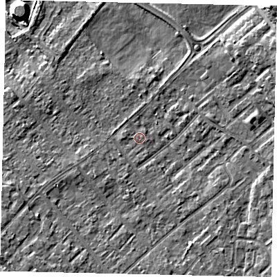 Shaded relief map of the ground around KT122EX, computed from Environment Agency LiDAR. The ground here sits at about 11 m above sea level and falls 8 m across the surrounding 800 m. Surface water reaching this point runs off ground lying to the south-west, 4.2 m higher.