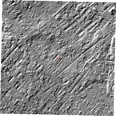Shaded relief map of the ground around KT122HB, computed from Environment Agency LiDAR. The ground here sits at about 12 m above sea level and falls 8 m across the surrounding 800 m. Surface water reaching this point runs off ground lying to the south-west, 1.1 m higher.