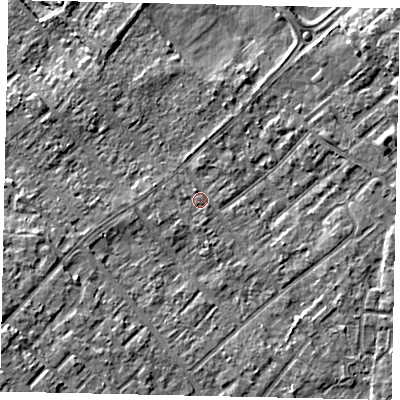 Shaded relief map of the ground around KT122HQ, computed from Environment Agency LiDAR. The ground here sits at about 12 m above sea level and falls 7 m across the surrounding 800 m. Surface water reaching this point runs off ground lying to the south-west, 5.1 m higher.