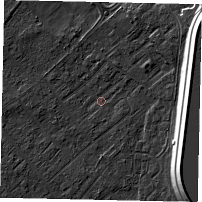 Shaded relief map of the ground around KT122HW, computed from Environment Agency LiDAR. The ground here sits at about 11 m above sea level and falls 16 m across the surrounding 800 m. Surface water reaching this point runs off ground lying to the east-south-east, 15.0 m higher.