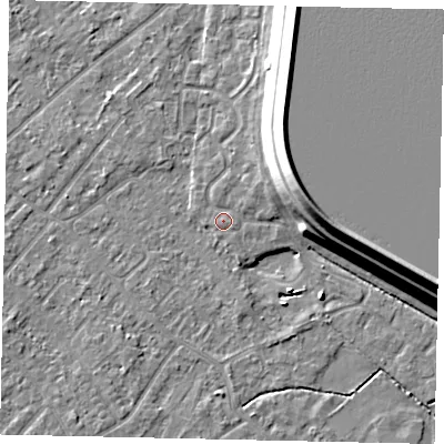 Shaded relief map of the ground around KT122LW, computed from Environment Agency LiDAR. The ground here sits at about 12 m above sea level and falls 15 m across the surrounding 800 m. Surface water reaching this point runs off ground lying to the north-east, 1.3 m higher.