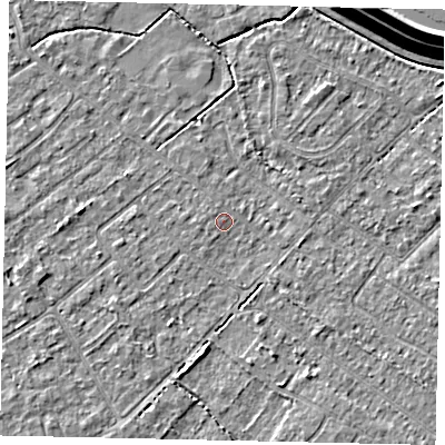 Shaded relief map of the ground around KT123LW, computed from Environment Agency LiDAR. The ground here sits at about 12 m above sea level and falls 15 m across the surrounding 800 m. Surface water reaching this point runs off ground lying to the south, 2.4 m higher.