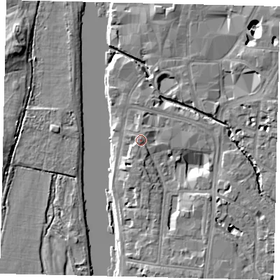 Shaded relief map of the ground around KT12AE, computed from Environment Agency LiDAR. The ground here sits at about 9 m above sea level and falls 9 m across the surrounding 800 m. Surface water reaching this point runs off ground lying to the south, 1.7 m higher.