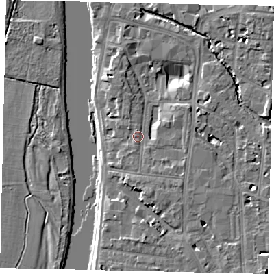 Shaded relief map of the ground around KT12AU, computed from Environment Agency LiDAR. The ground here sits at about 9 m above sea level and falls 8 m across the surrounding 800 m. Surface water reaching this point runs off ground lying to the south-east, 2.2 m higher.