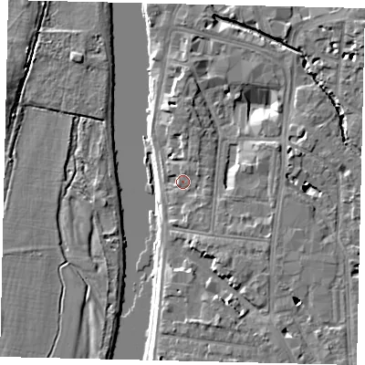 Shaded relief map of the ground around KT12LX, computed from Environment Agency LiDAR. The ground here sits at about 9 m above sea level and falls 7 m across the surrounding 800 m. Surface water reaching this point runs off ground lying to the east-north-east, 1.8 m higher.