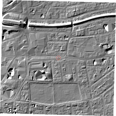 Shaded relief map of the ground around KT12QY, computed from Environment Agency LiDAR. The ground here sits at about 9 m above sea level and falls 12 m across the surrounding 800 m. Surface water reaching this point runs off ground lying to the south-south-east, 1.7 m higher.