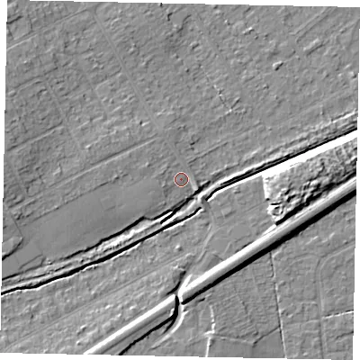 Shaded relief map of the ground around KT153HH, computed from Environment Agency LiDAR. The ground here sits at about 21 m above sea level and falls 9 m across the surrounding 800 m. Surface water reaching this point runs off ground lying to the west, 3.3 m higher.