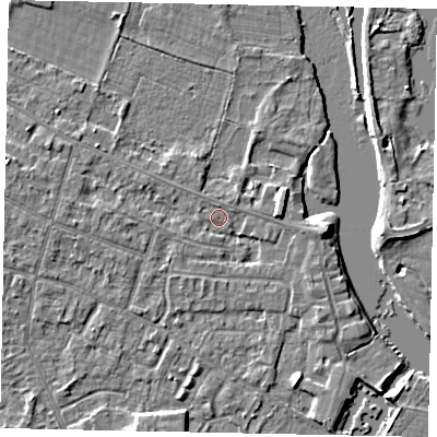 Shaded relief map of the ground around KT168LE, computed from Environment Agency LiDAR. The ground here sits at about 12 m above sea level and falls 4 m across the surrounding 800 m. Surface water reaching this point runs off ground lying to the west, 2.1 m higher.