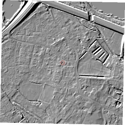 Shaded relief map of the ground around KT169DG, computed from Environment Agency LiDAR. The ground here sits at about 13 m above sea level and falls 12 m across the surrounding 800 m. Surface water reaching this point runs off ground lying to the south-east, 1.7 m higher.