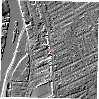 Shaded relief map of the ground around KT25BZ, computed from Environment Agency LiDAR. The ground here sits at about 9 m above sea level and falls 6 m across the surrounding 800 m. Surface water reaching this point runs off ground lying to the north-north-east, 2.7 m higher.
