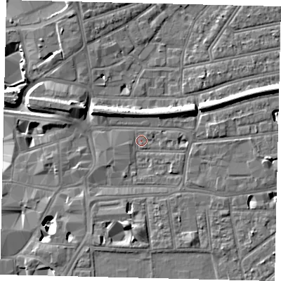 Shaded relief map of the ground around KT26ST, computed from Environment Agency LiDAR. The ground here sits at about 9 m above sea level and falls 11 m across the surrounding 800 m. Surface water reaching this point runs off ground lying to the south-west, 1.1 m higher.