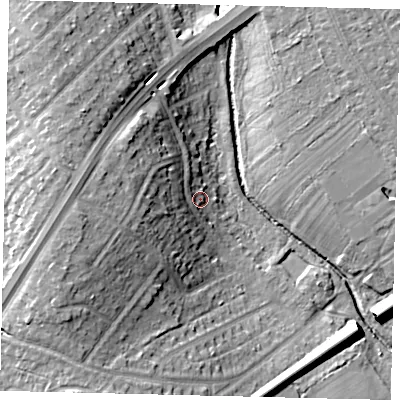 Shaded relief map of the ground around KT59PJ, computed from Environment Agency LiDAR. The ground here sits at about 18 m above sea level and falls 18 m across the surrounding 800 m. Surface water reaching this point runs off ground lying to the west, 7.3 m higher.