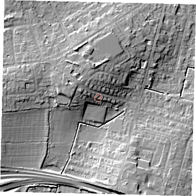 Shaded relief map of the ground around KT65BX, computed from Environment Agency LiDAR. The ground here sits at about 33 m above sea level and falls 13 m across the surrounding 800 m. Surface water reaching this point runs off ground lying to the west-north-west, 5.0 m higher.