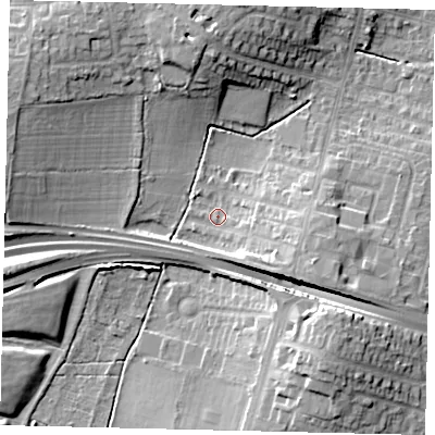 Shaded relief map of the ground around KT65DA, computed from Environment Agency LiDAR. The ground here sits at about 29 m above sea level and falls 14 m across the surrounding 800 m. Surface water reaching this point runs off ground lying to the south-east, 7.3 m higher.