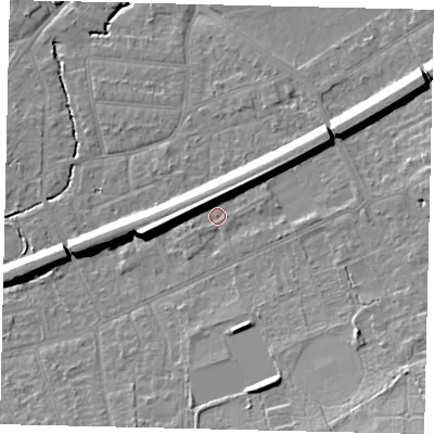 Shaded relief map of the ground around KT70AN, computed from Environment Agency LiDAR. The ground here sits at about 12 m above sea level and falls 15 m across the surrounding 800 m. Surface water reaching this point runs off ground lying to the north-west, 7.5 m higher.