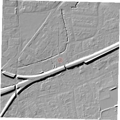 Shaded relief map of the ground around KT70AZ, computed from Environment Agency LiDAR. The ground here sits at about 11 m above sea level and falls 12 m across the surrounding 800 m. Surface water reaching this point runs off ground lying to the east, 10.0 m higher.