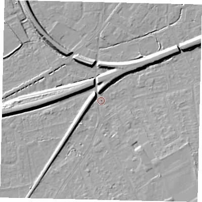 Shaded relief map of the ground around KT70DT, computed from Environment Agency LiDAR. The ground here sits at about 12 m above sea level and falls 10 m across the surrounding 800 m. Surface water reaching this point runs off ground lying to the north-north-west, 5.8 m higher.