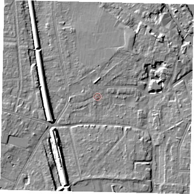Shaded relief map of the ground around KT70NP, computed from Environment Agency LiDAR. The ground here sits at about 9 m above sea level and falls 12 m across the surrounding 800 m. Surface water reaching this point runs off ground lying to the north, 1.7 m higher.