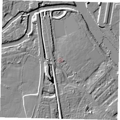 Shaded relief map of the ground around KT70RD, computed from Environment Agency LiDAR. The ground here sits at about 7 m above sea level and falls 9 m across the surrounding 800 m. Surface water reaching this point runs off ground lying to the south, 3.3 m higher.