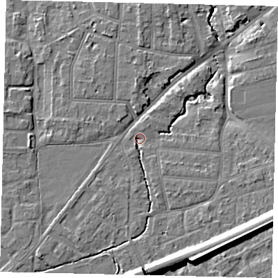 Shaded relief map of the ground around KT70TA, computed from Environment Agency LiDAR. The ground here sits at about 9 m above sea level and falls 14 m across the surrounding 800 m. Surface water reaching this point runs off ground lying to the south-south-east, 2.6 m higher.