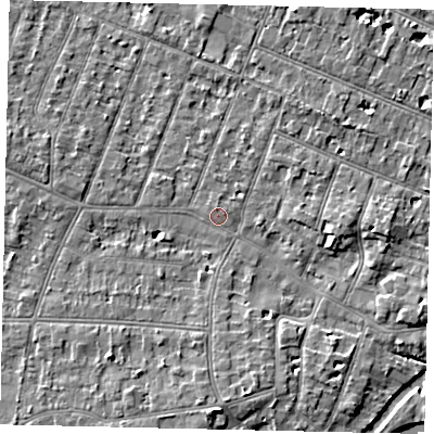 Shaded relief map of the ground around KT80DR, computed from Environment Agency LiDAR. The ground here sits at about 9 m above sea level and falls 6 m across the surrounding 800 m. Surface water reaching this point runs off ground lying to the east, 3.8 m higher.