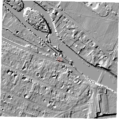 Shaded relief map of the ground around KT89AJ, computed from Environment Agency LiDAR. The ground here sits at about 9 m above sea level and falls 9 m across the surrounding 800 m. Surface water reaching this point runs off ground lying to the west, 4.8 m higher.