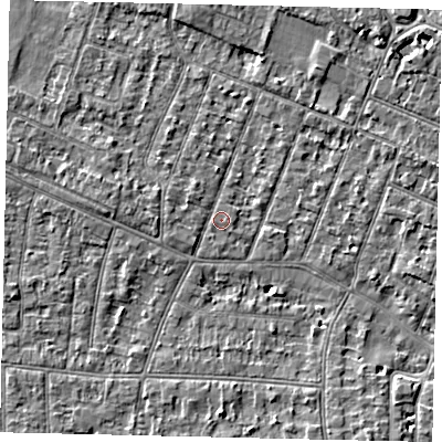 Shaded relief map of the ground around KT89LP, computed from Environment Agency LiDAR. The ground here sits at about 9 m above sea level and falls 4 m across the surrounding 800 m. Surface water reaching this point runs off ground lying to the west, 1.8 m higher.