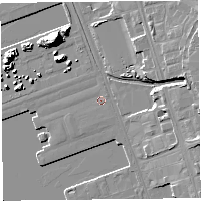 Shaded relief map of the ground around L201DB, computed from Environment Agency LiDAR. The ground here sits at about 7 m above sea level and falls 18 m across the surrounding 800 m. The ground contributing surface water to this point lies to the east.